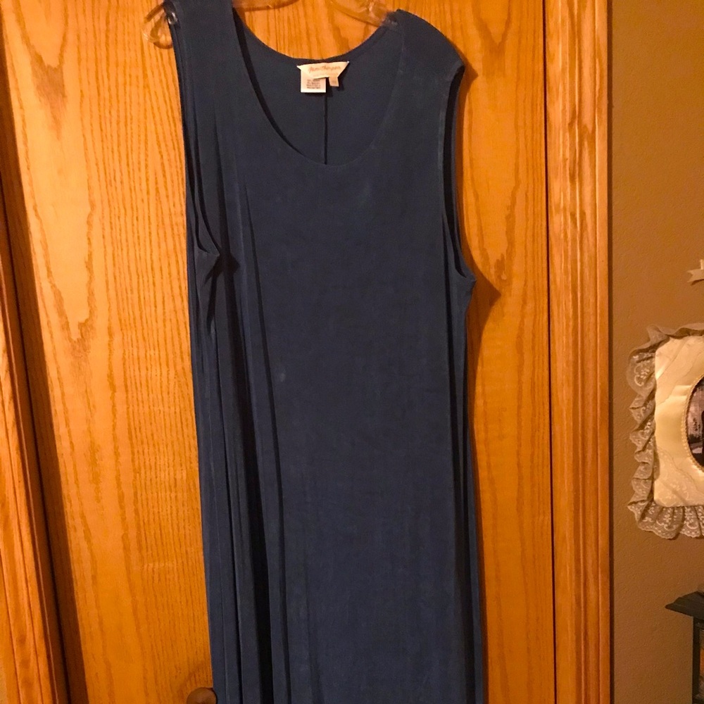 Maxi dress of blue slinky material. Is a great dress for traveling.